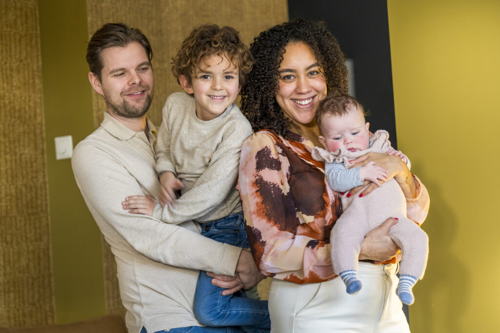 happy young couple with child