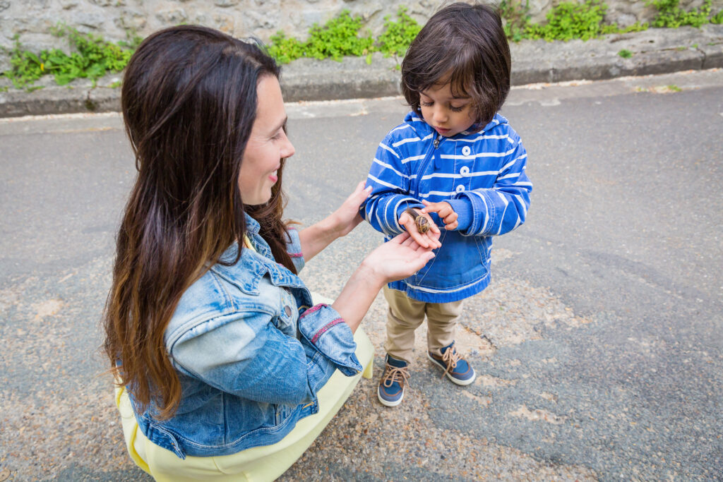 Mother and little eastern handsome baby boy playing outdoor