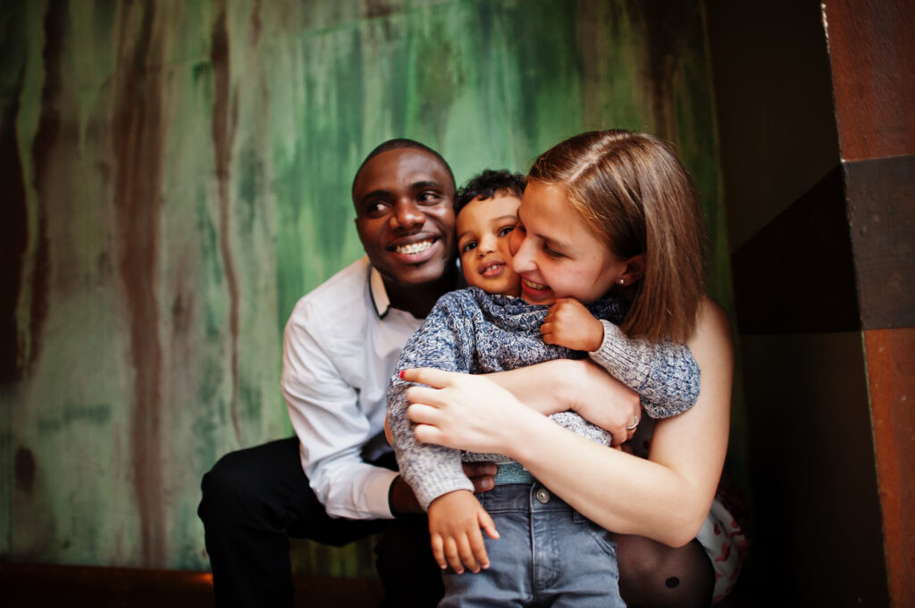 Happy multiethnic family with boy kid