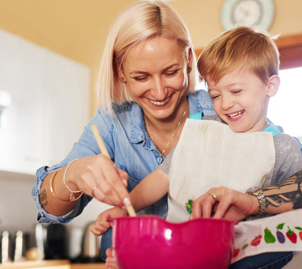 mother and son baking together at home