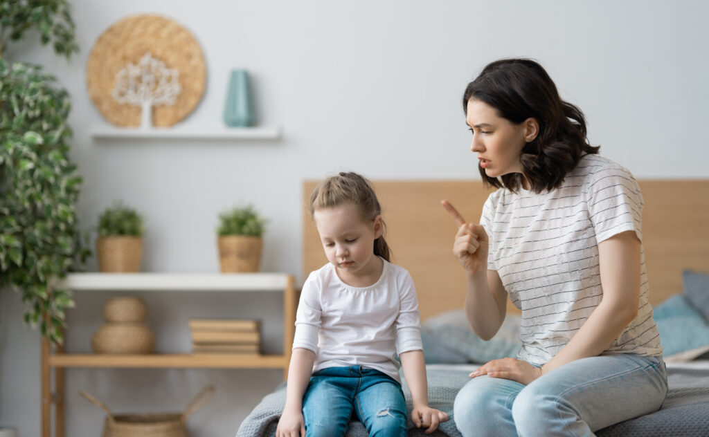 mother is scolding her child girl