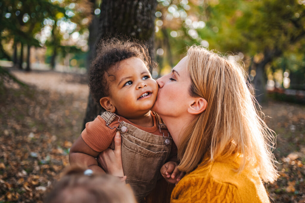 mom kissing her child