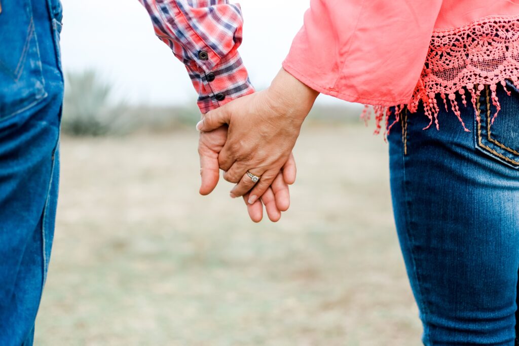 husband holding wife's hand