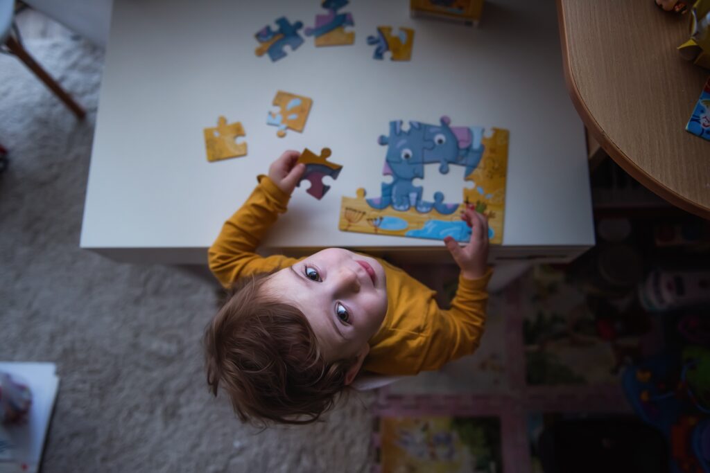 toddler solving the puzzle