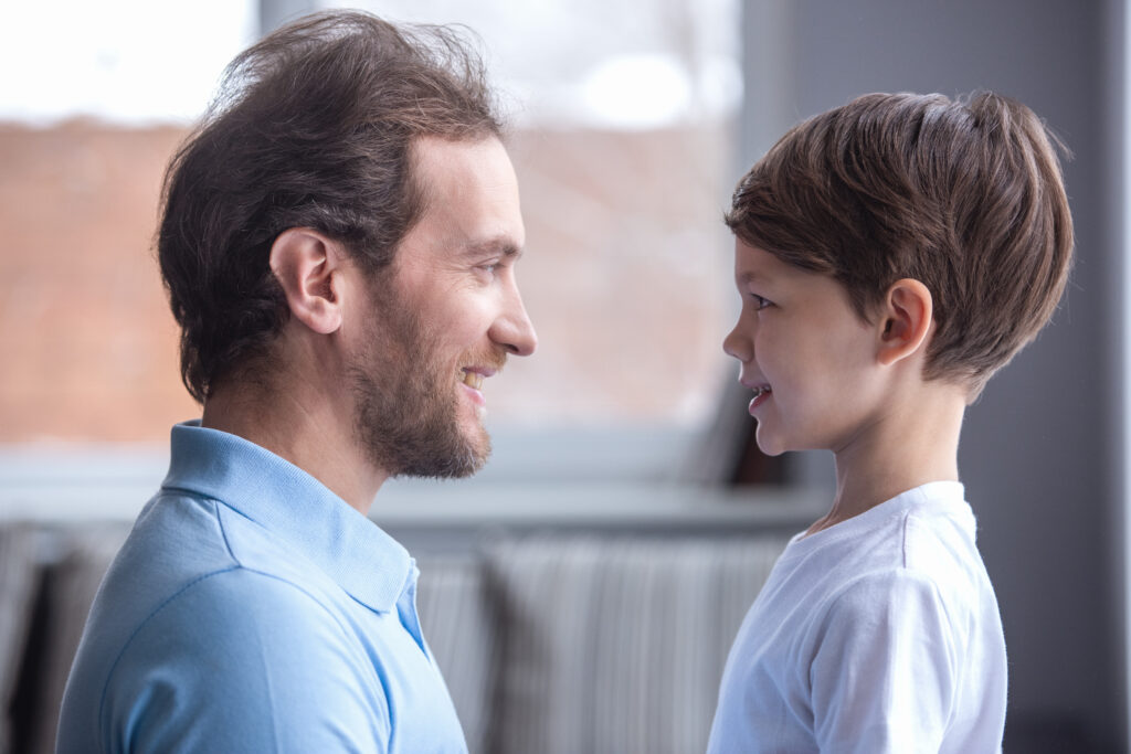 Father and son looking at each other