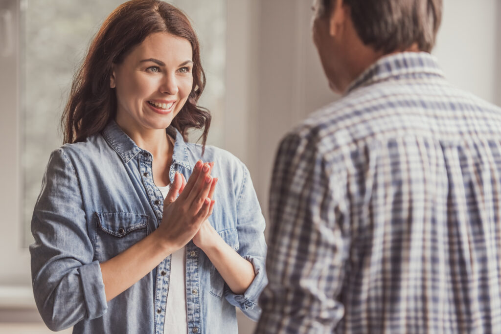 Beautiful woman is feeling happy while talking to her husband