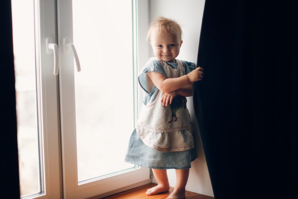 toddler playing hide and seek