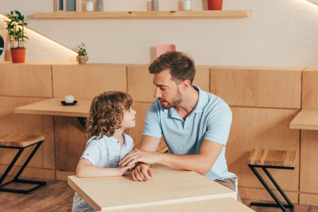 dad and kid talking