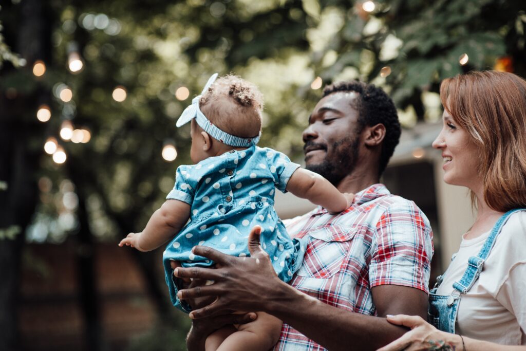 husband and wife with baby girl