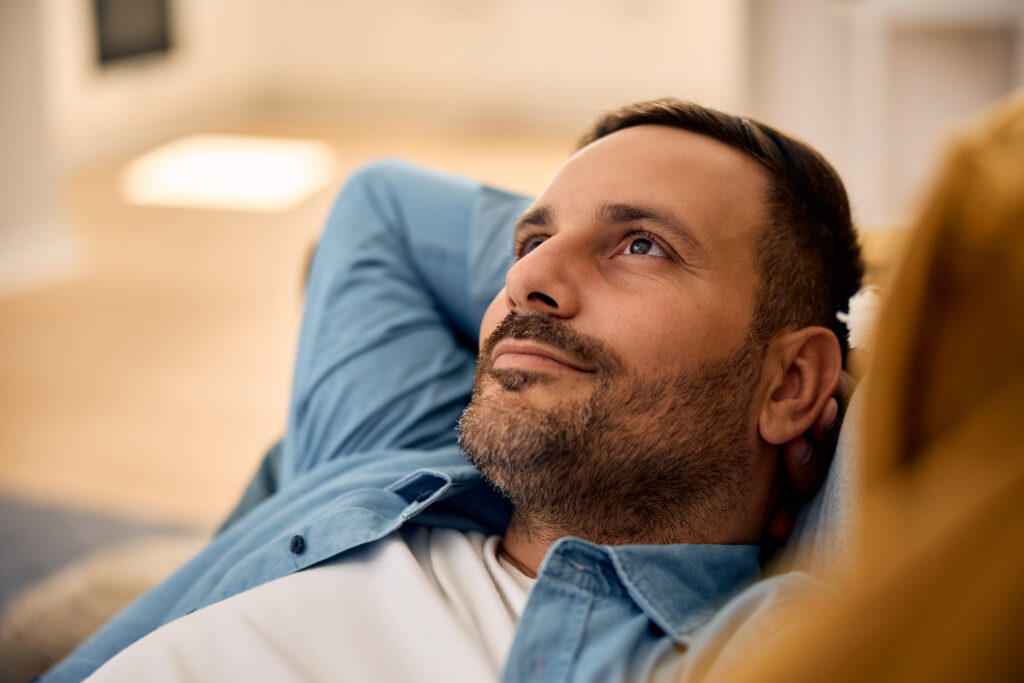 Relaxed man thinking of something