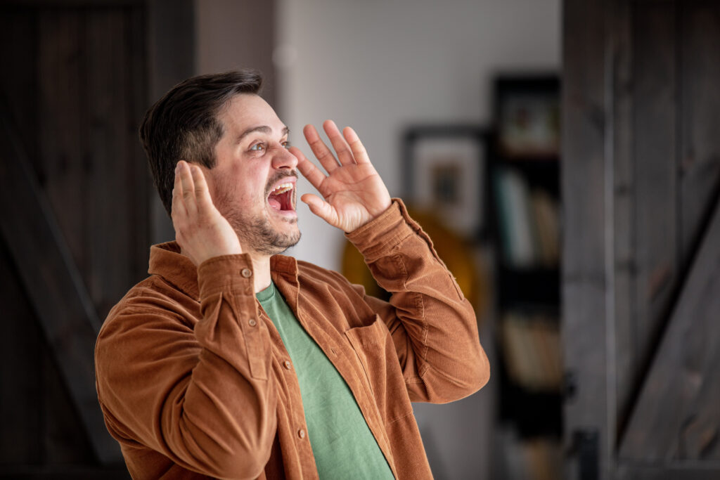 man screaming from stress