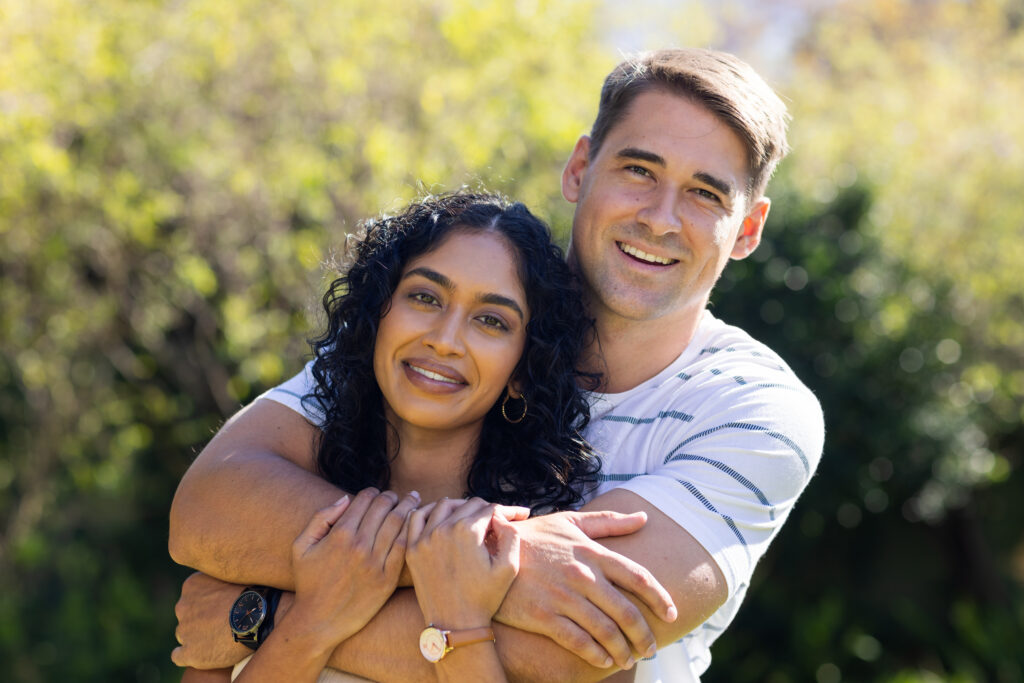 young couple outdoors in park setting